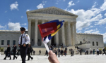 People cheer as the legal teams defending same-sex marriages leave the US Supreme Court