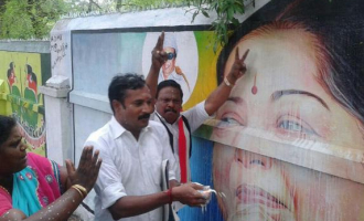 AIADMK cadre celebrate Jayalalithaa's acquittal with an offereing of milk in Madurai.