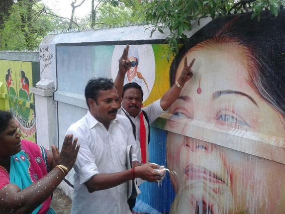 AIADMK cadre celebrate Jayalalithaa's acquittal with an offereing of milk in Madurai.