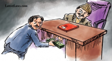  A government officer was caught red-handed while taking bribe