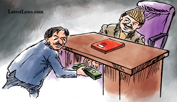  A government officer was caught red-handed while taking bribe