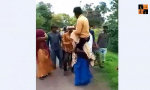 Woman carrying Husband.png, pic by indianews