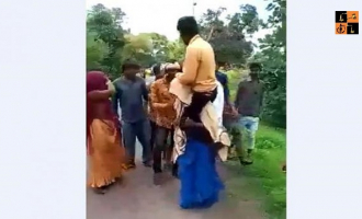 Woman carrying Husband.png, pic by indianews