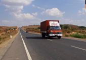 red-truck-on-highway-in-India.jpg, pic source: https://pixy.org/201755/