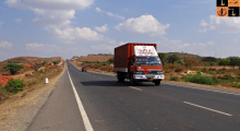 red-truck-on-highway-in-India.jpg, pic source: https://pixy.org/201755/