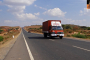 red-truck-on-highway-in-India.jpg, pic source: https://pixy.org/201755/